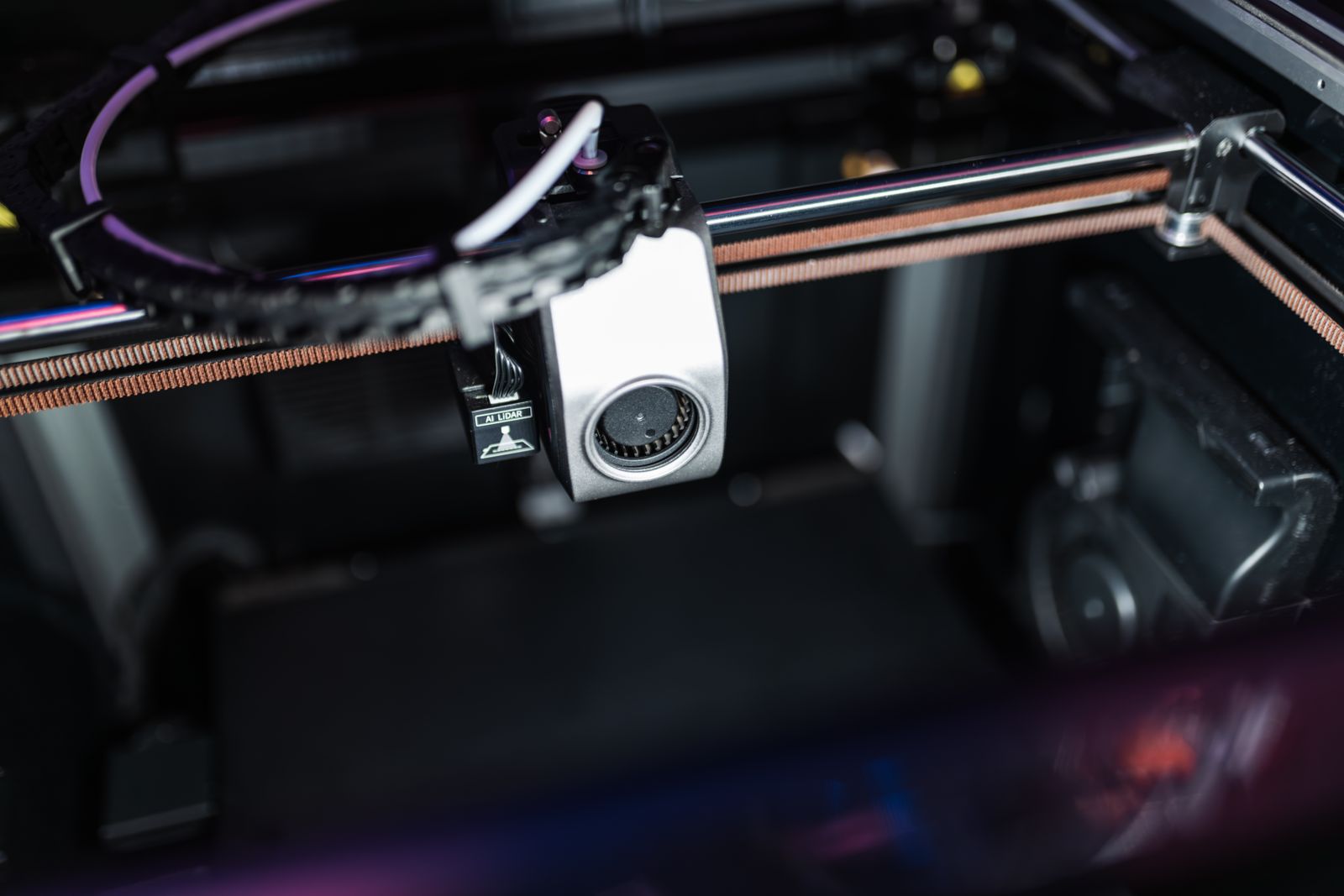 3D printer making a piece in green filament